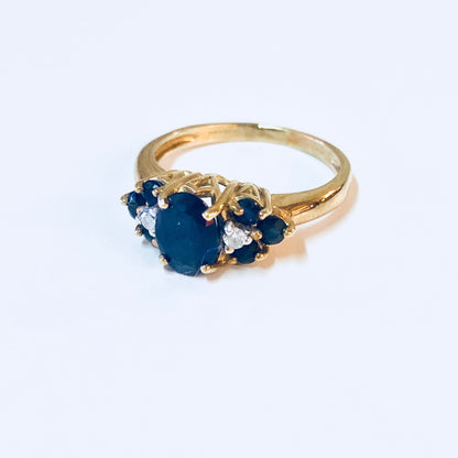 Vintage 14K yellow gold ring with blue sapphire and diamond accents, suitable for engagement, wedding or September birthstone jewelry.