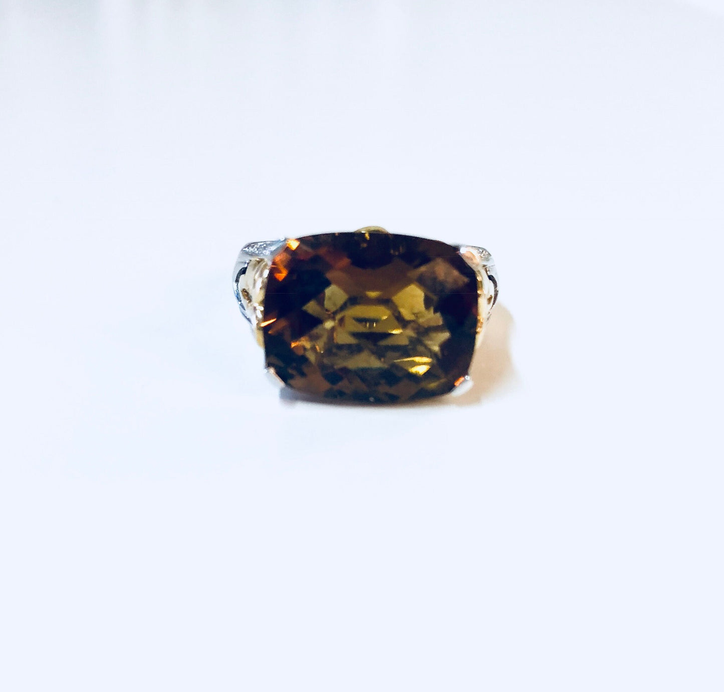 Vintage sterling silver cocktail ring with a large topaz-colored cubic zirconia gemstone in an ornate gold-tone setting, making a bold statement piece suitable for anniversaries or special occasions.