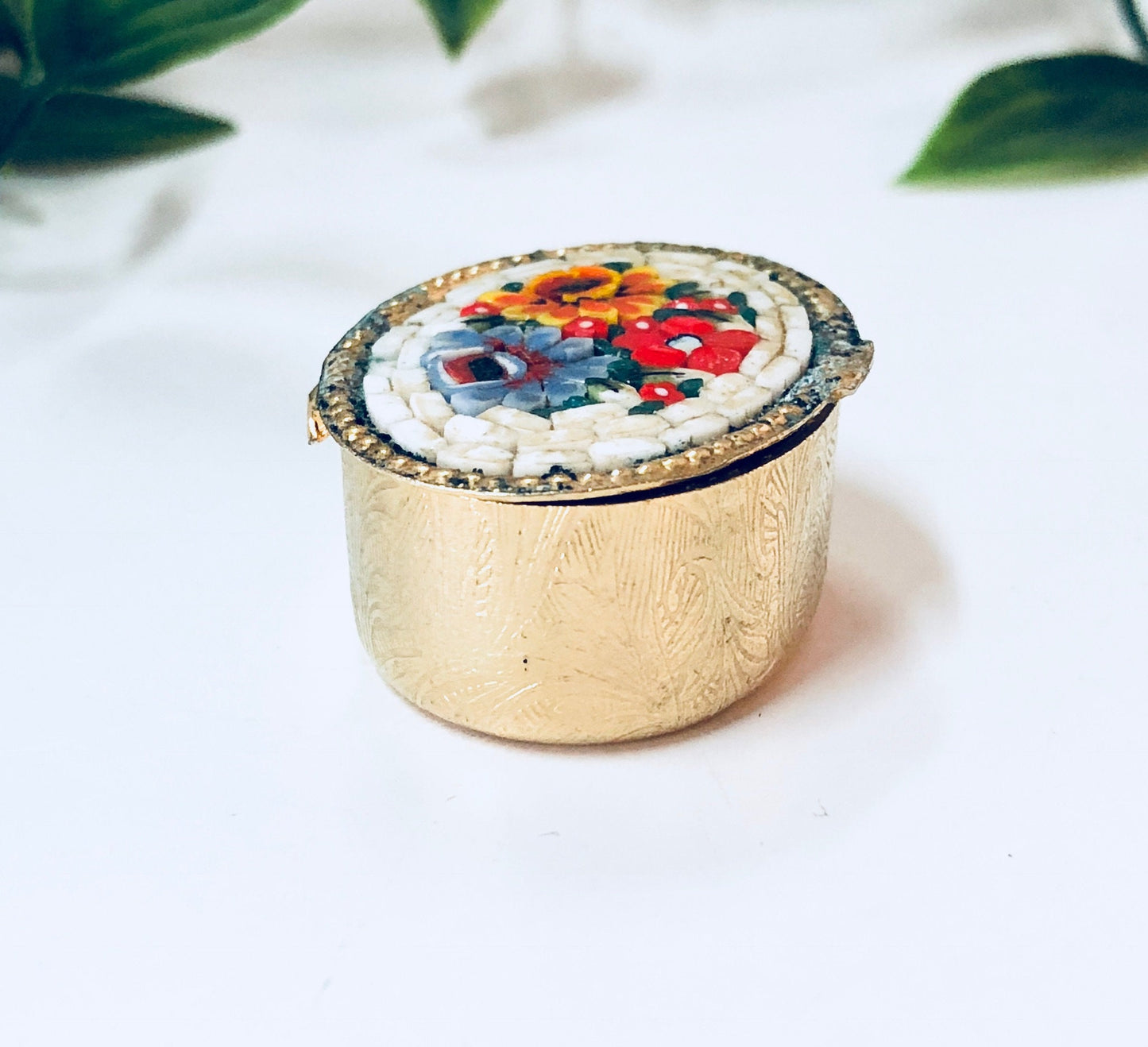 Vintage gold toned Millefiori mosaic pill box with red, blue, orange and white swirl paisley design, small trinket case