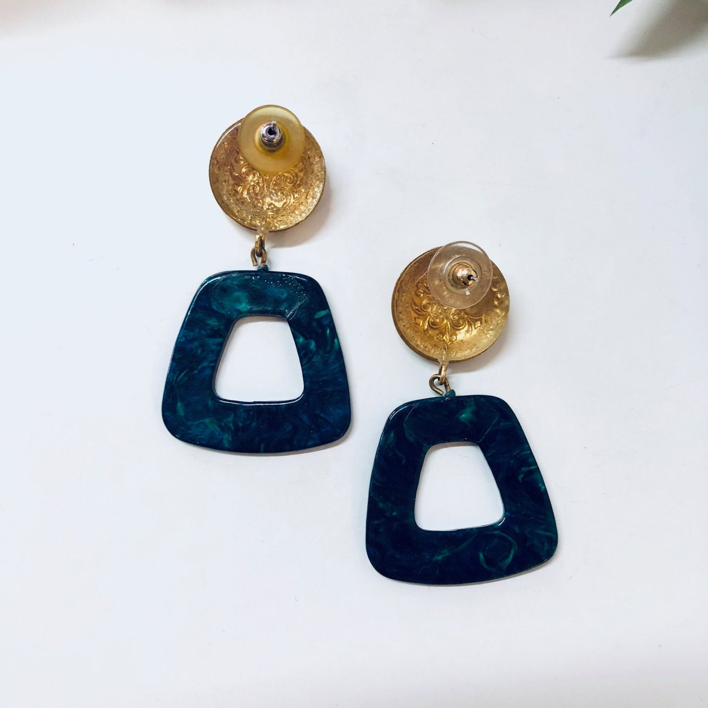 Vintage gold-tone dangle earrings with blue marble acrylic geometric shapes, designed for pierced ears.