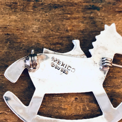 Vintage silver rocking horse brooch, made in Mexico 925 silver, horse-shaped pin jewelry on wooden background, suitable as Valentine's Day gift.