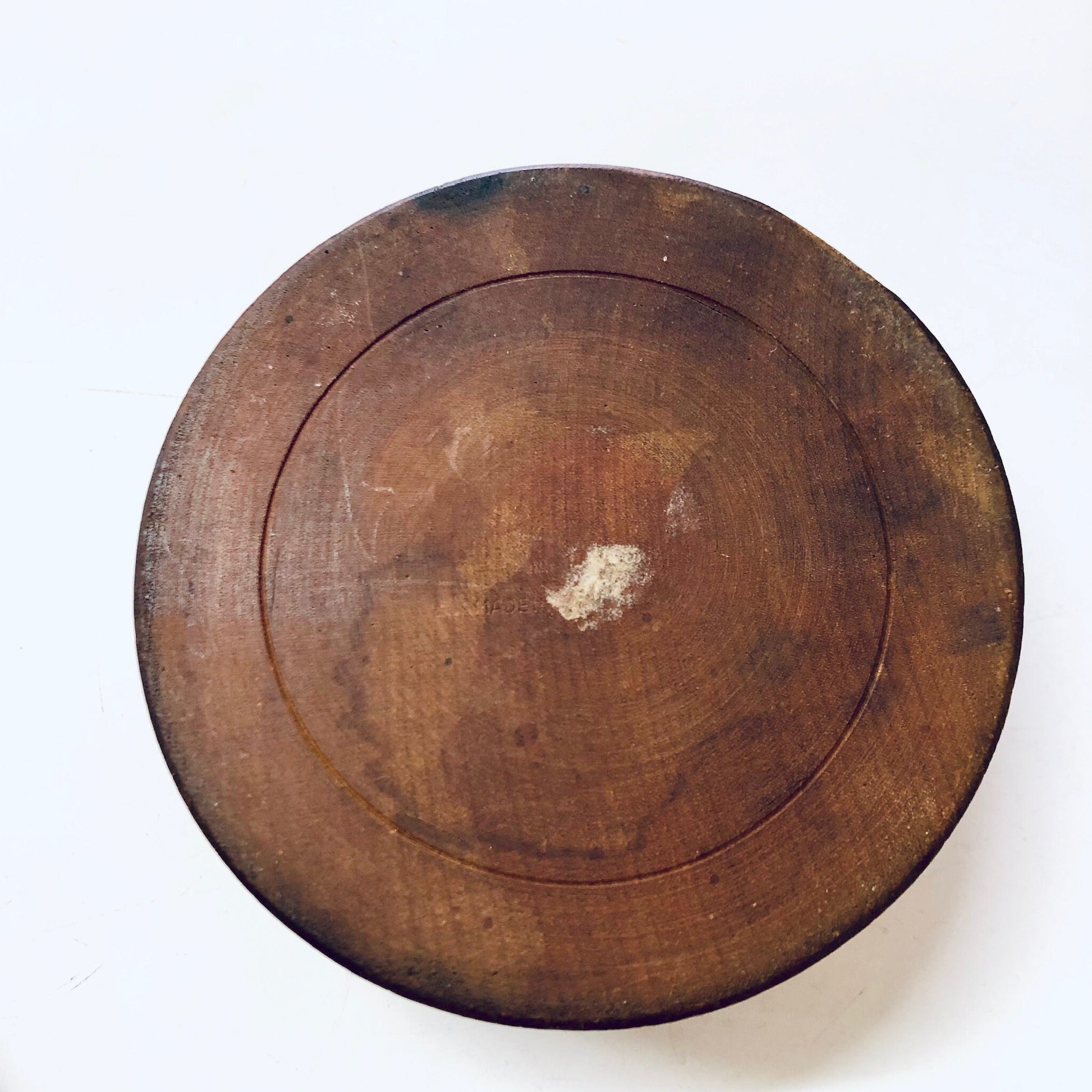 Vintage round wooden carved jewelry box with rustic patina, perfect for storing trinkets or as unique home decor