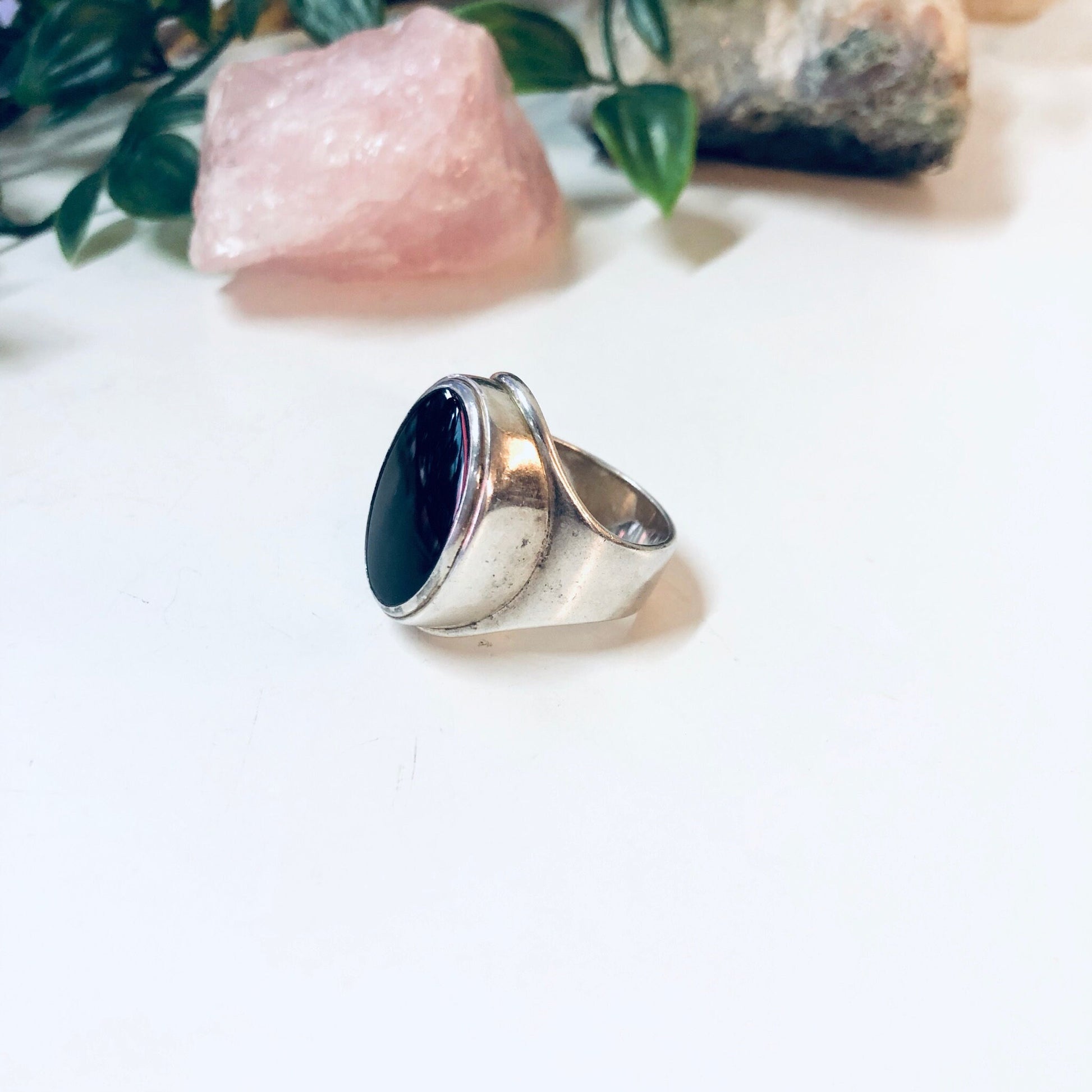 Vintage silver ring with oval-shaped black onyx stone, designed by Mike Heintz. Large, simple designer jewelry piece showcasing classic vintage style.