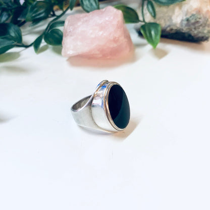 Vintage silver ring with oval-shaped black onyx stone, designer jewelry by Mike Heintz, simple large ring