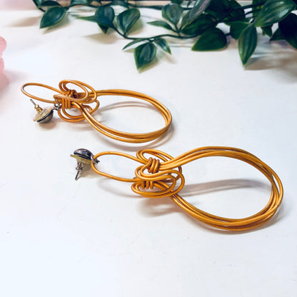 Vintage orange wire dangle earrings with unique abstract design, perfect for a bold statement look or Valentine's Day gift.