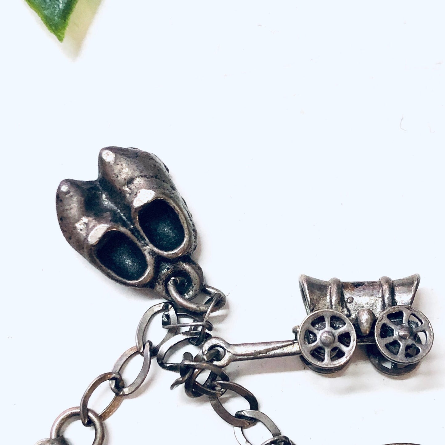 Vintage silver charm bracelet with two adorable shoe charms and a linked chain design, perfect as a Valentine's Day gift or unique accessory for any occasion.