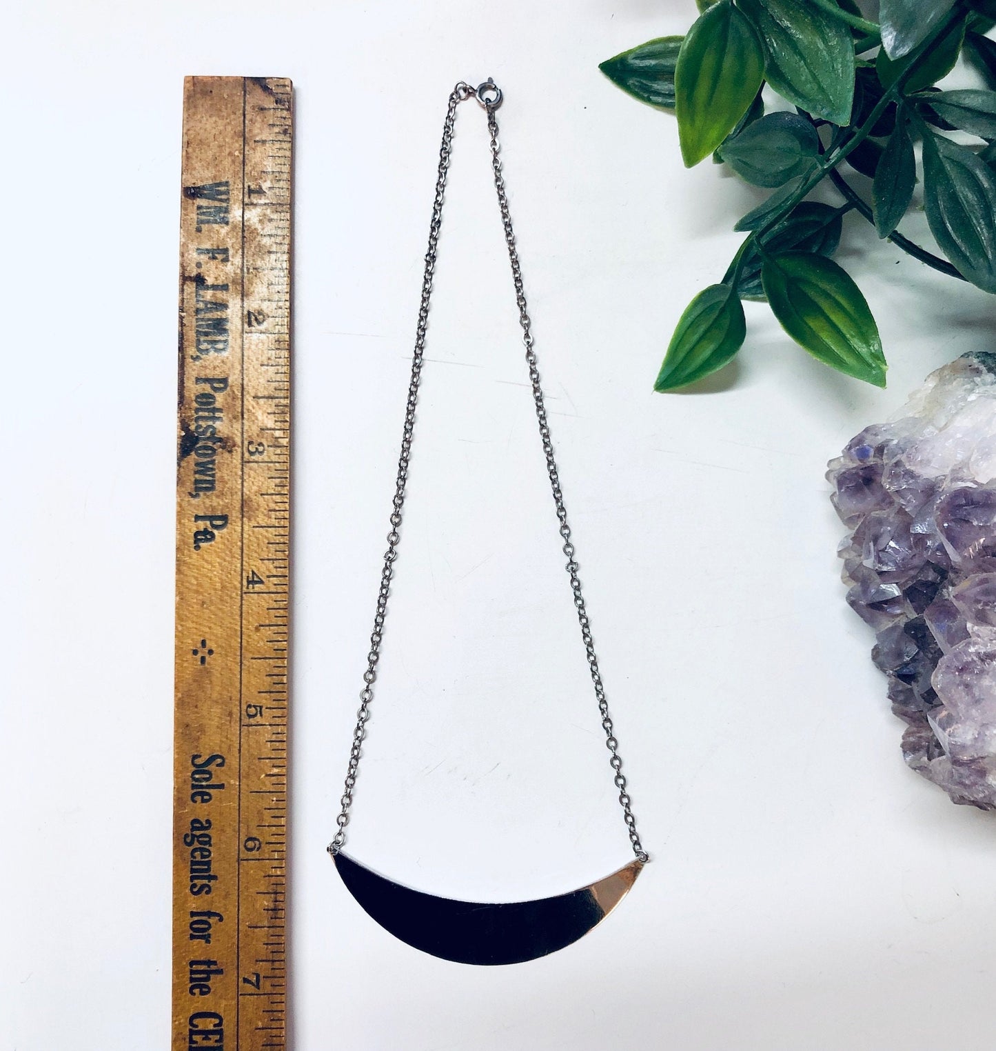 Vintage Danecraft silver panel pendant necklace with minimalist geometric design, shown with ruler and decorative crystals for size reference.