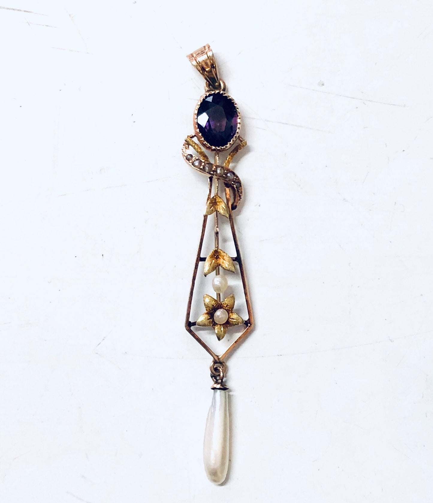 Vintage 14K yellow gold pendant necklace with amethyst stone, pearl accent, and floral design.