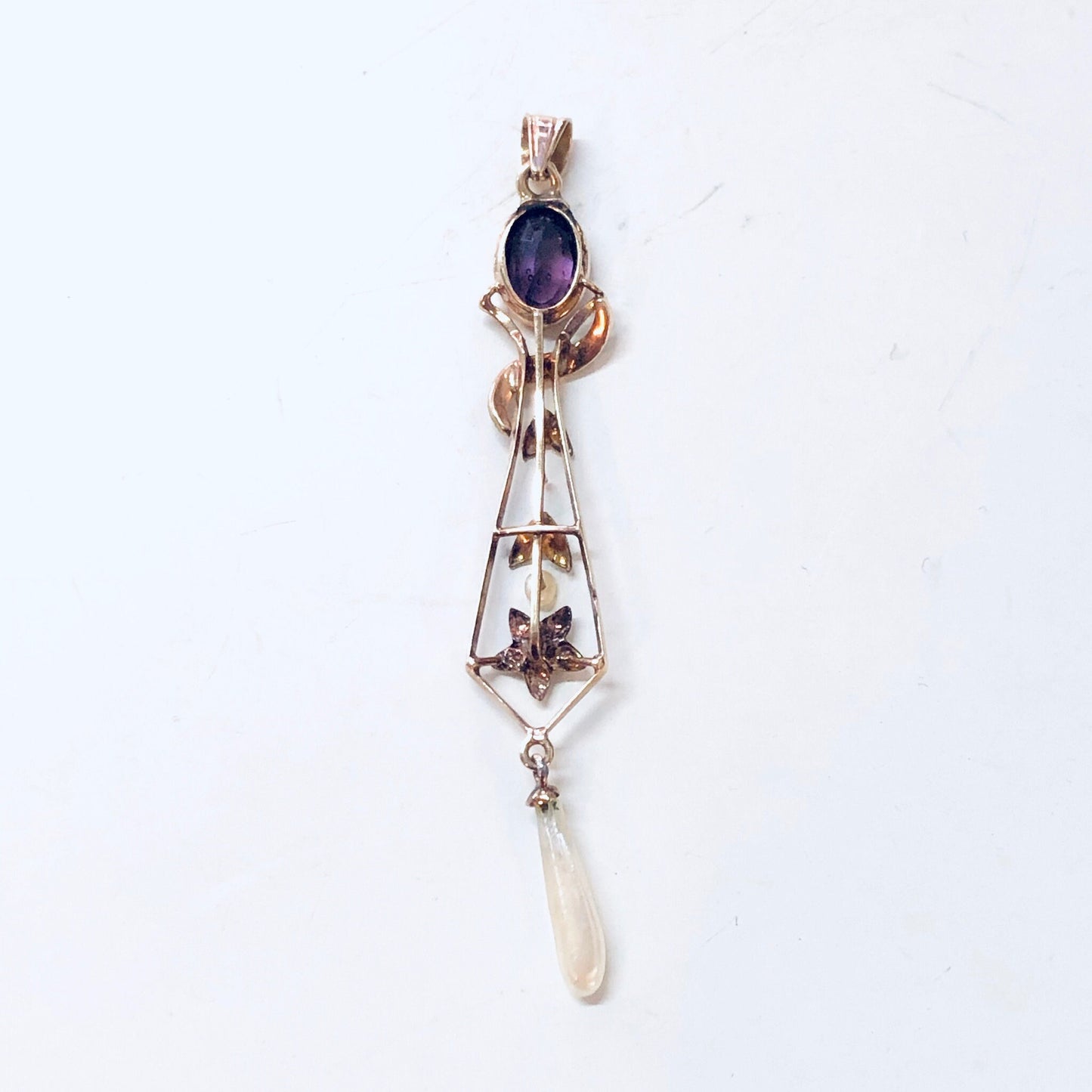 Vintage 14K yellow gold pendant with amethyst stone and pearl accents in floral design