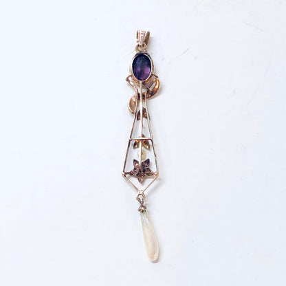 Vintage 14K yellow gold pendant with amethyst stone and pearl accents in floral design