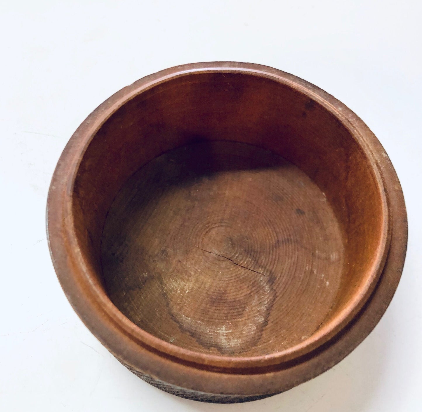 Vintage carved wooden trinket box with round shape and deep brown finish, suitable for storing jewelry or small items and adding unique decor to the home.