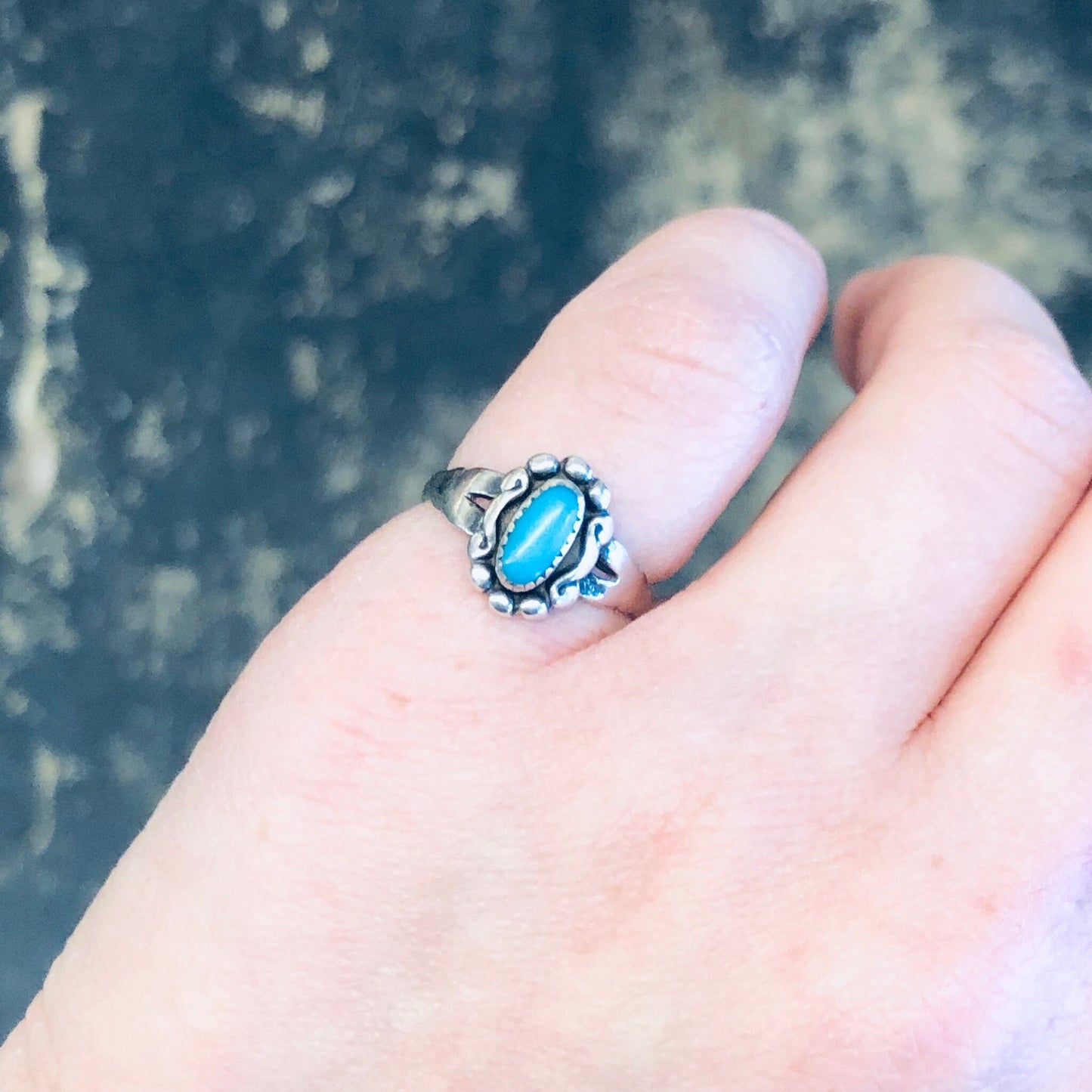 Vintage silver ring with turquoise stone on person's finger, bohemian pinky ring in Southwestern style, small 925 silver boho ring