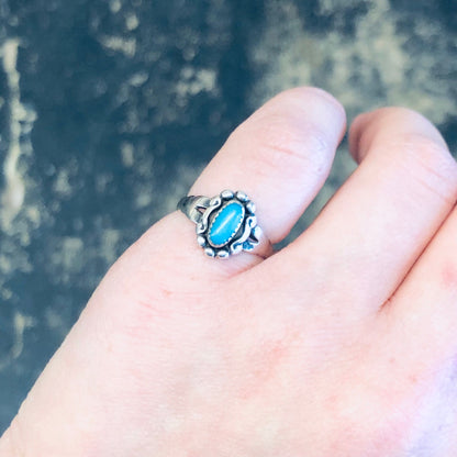 Vintage silver ring with turquoise stone on person's finger, bohemian pinky ring in Southwestern style, small 925 silver boho ring