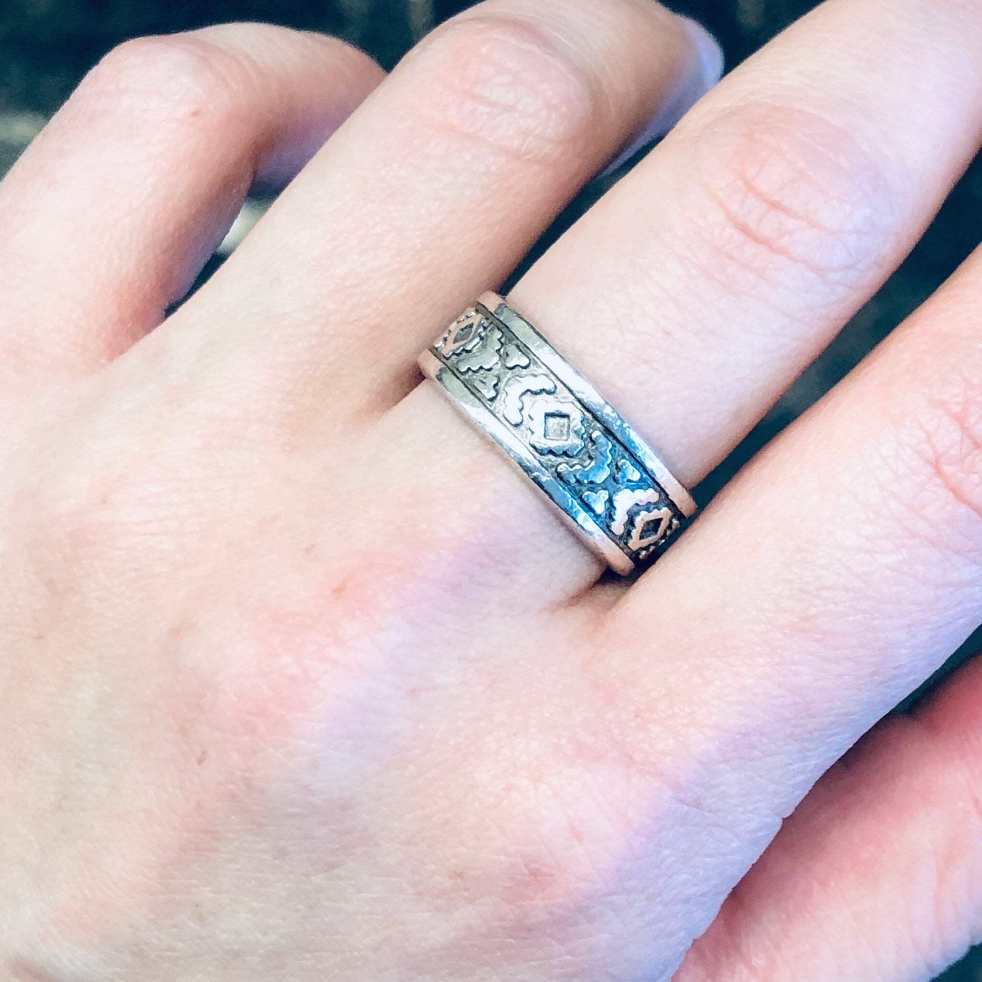 Vintage silver band ring with unique blue patterned design worn on finger, bohemian style skinny ring, simple jewelry gift idea for mom.