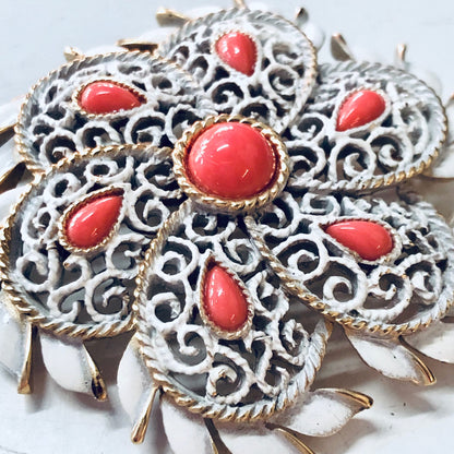 Vintage Trifari white enamel brooch with coral cabochons and gold tone rope trim, statement costume jewelry pin from the 1960s.