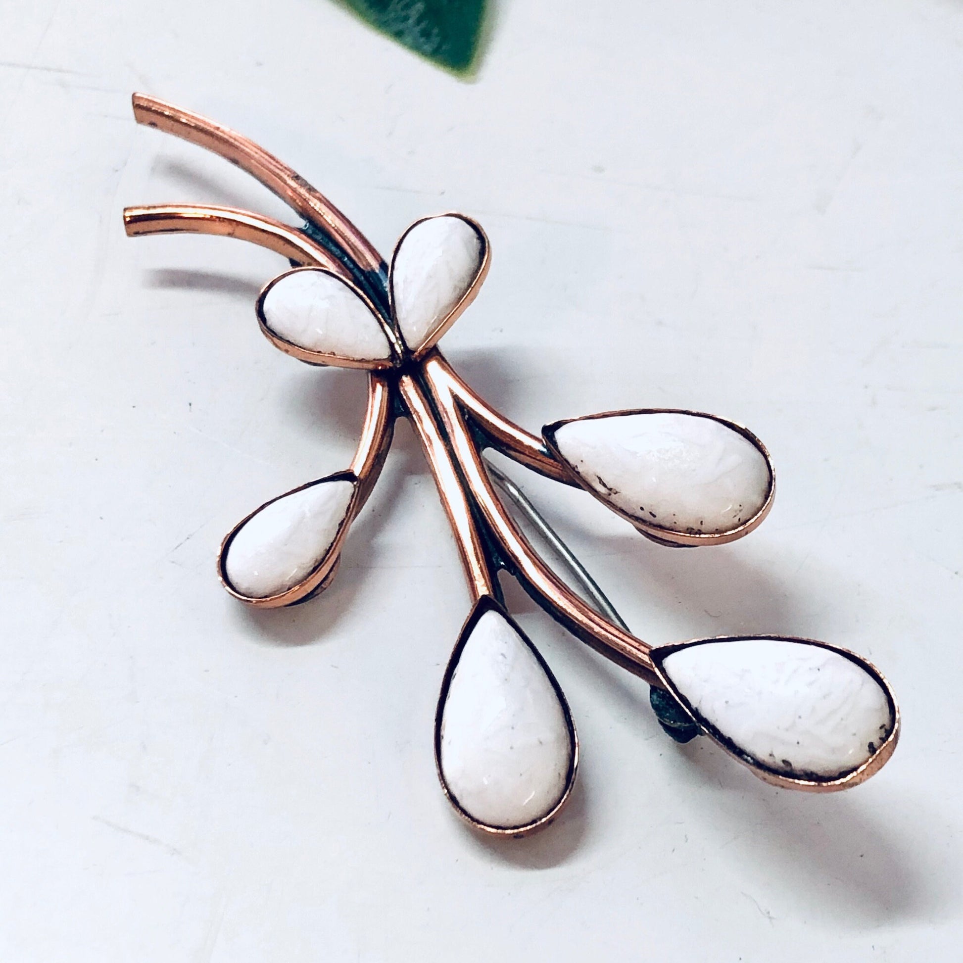 Vintage copper Matisse jewelry set with white enamel featuring a brooch and hinged cuff bracelet