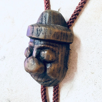 Vintage Japanese carved wooden face bolo tie with rope cord