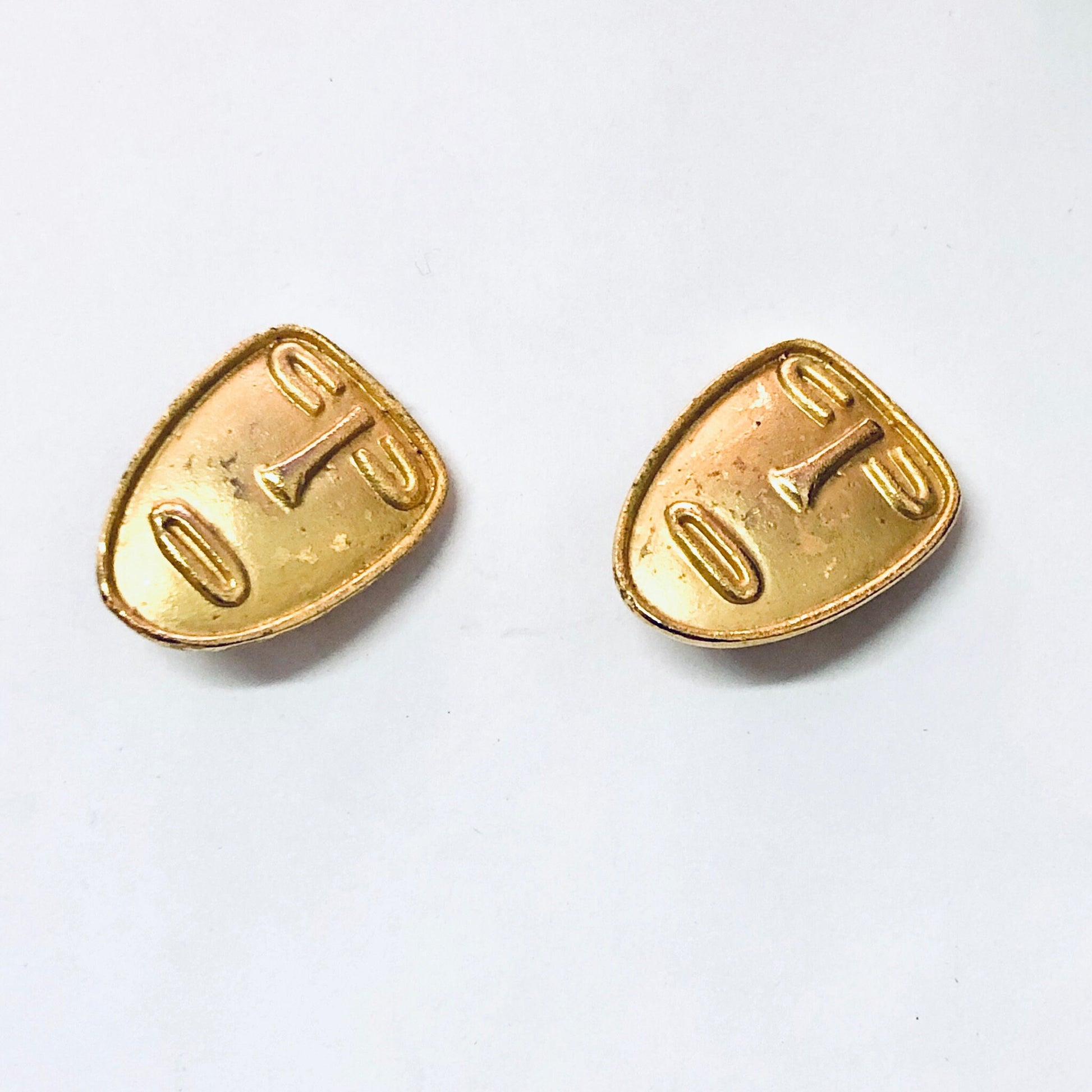 Vintage gold toned abstract face clip-on earrings