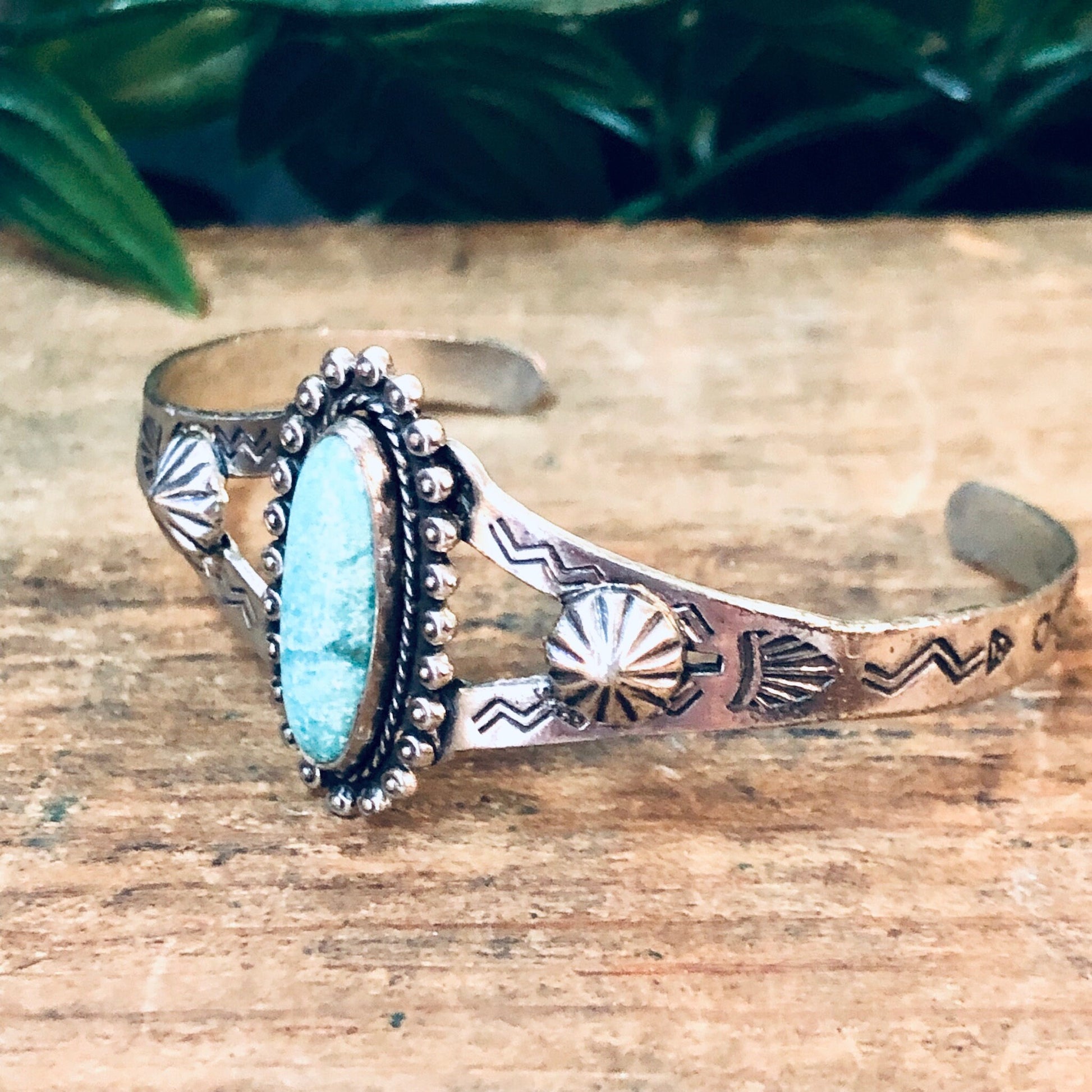 Vintage silver cuff bracelet with turquoise stone and southwestern stamped design