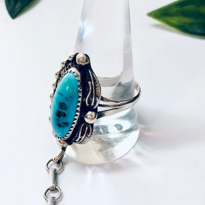 Vintage Navajo turquoise and sterling silver slave bracelet with hand-stamped detailing in a bohemian style, showcasing unique Navajo craftsmanship in an eye-catching jewelry piece.