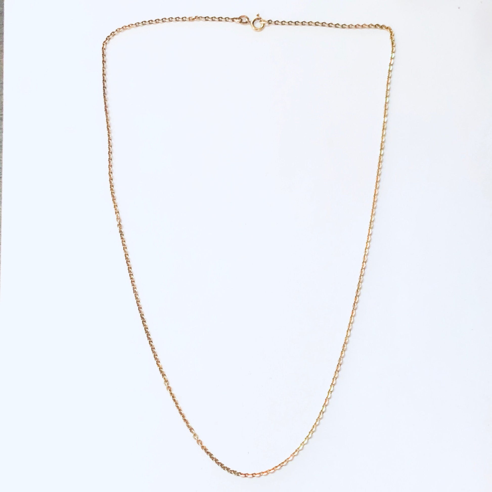 Gold chain necklace isolated on white background