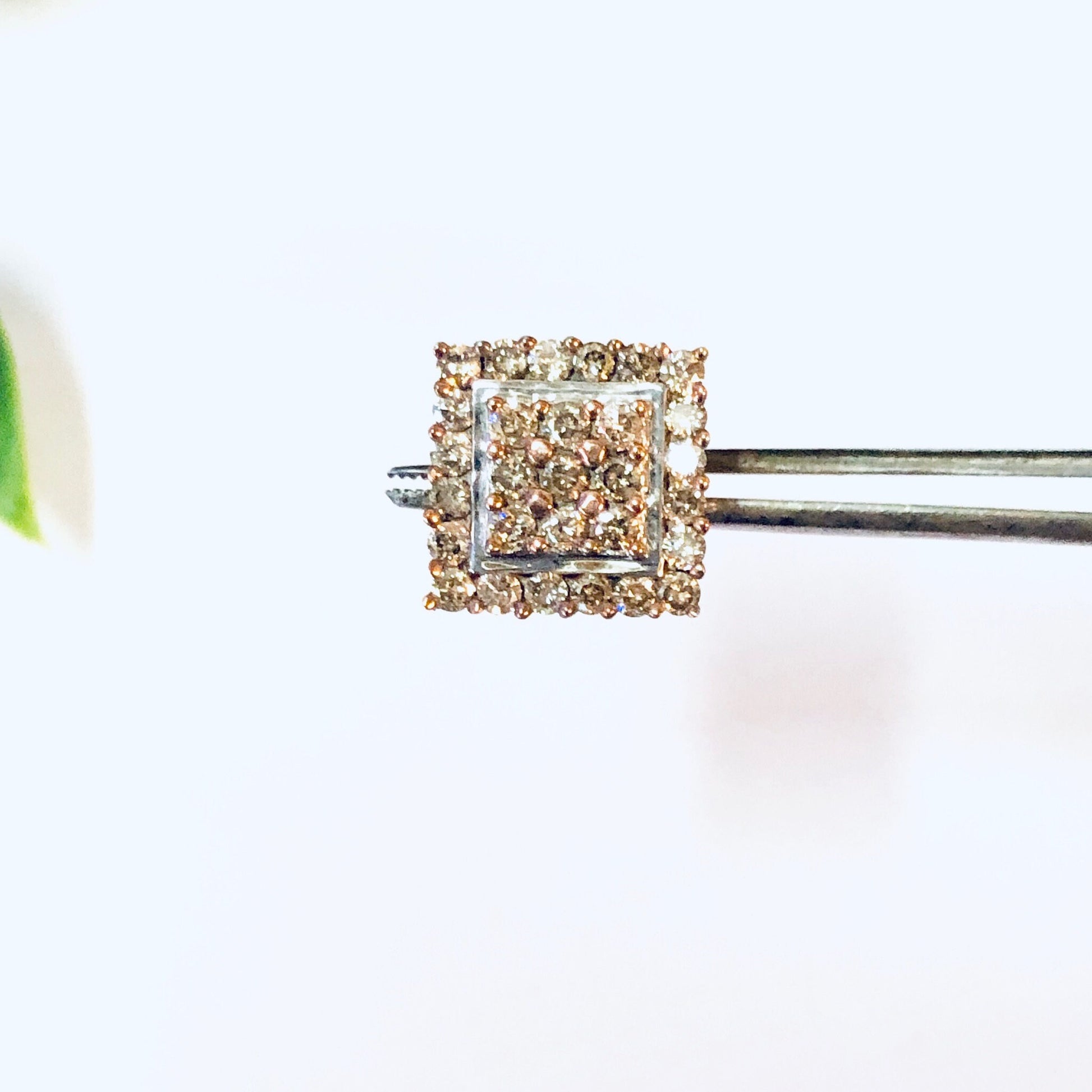 Vintage 10K gold diamond cluster earrings in Art Deco style, square stud design with intricate diamond setting.