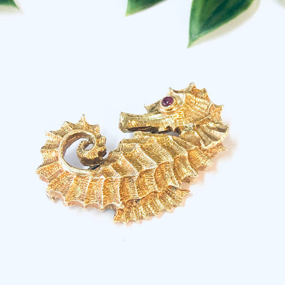 18K gold and platinum vintage David Webb seahorse brooch with ruby eye from the 1970s.