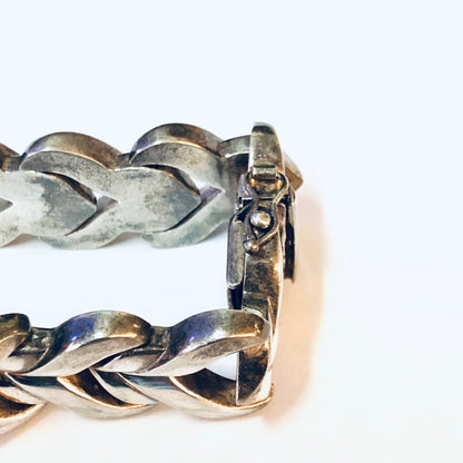 Vintage silver link bracelet with unique heart-shaped design, handmade in Italy.