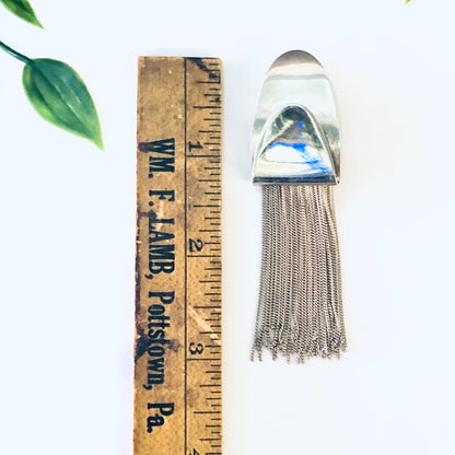 Vintage silver fringe clip-on earrings with unique design, made in Italy and marked 925 silver, displayed next to a wooden ruler for scale.