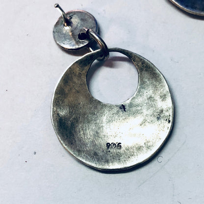 Vintage hammered silver dangle earrings with circular design and pierced post backs, marked 925.