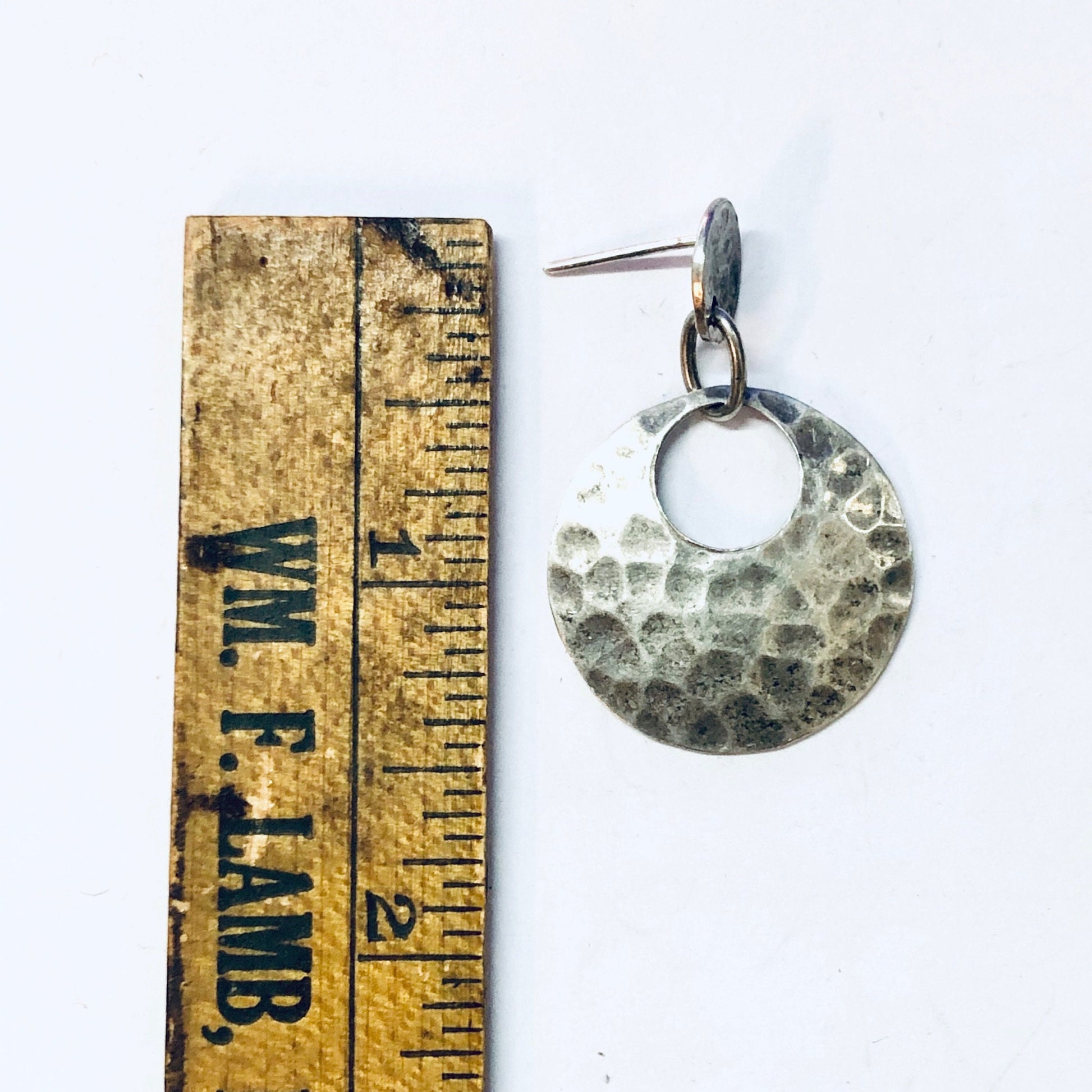 Vintage hammered silver circular dangle earrings with ruler for scale