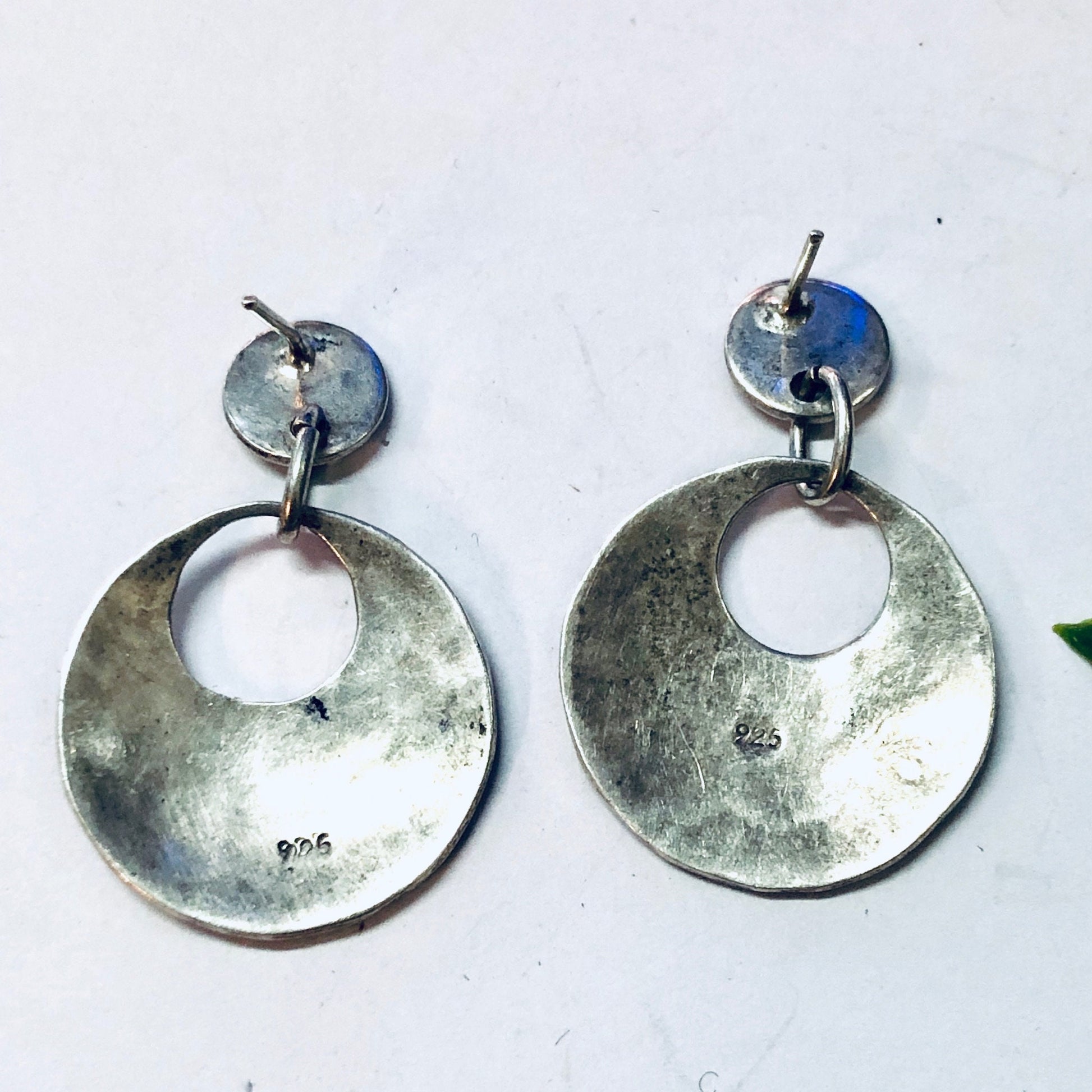 Vintage hammered silver dangle earrings with circular discs and blue crystal accents