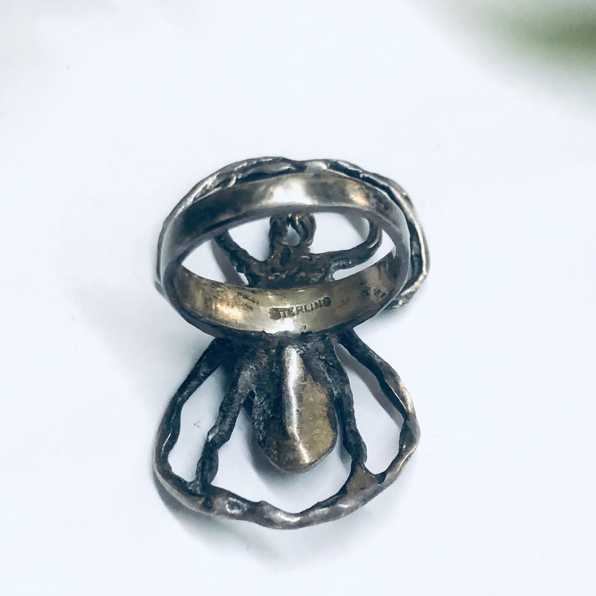 Vintage sterling silver spider ring with intricate detailing, a spooky statement jewelry piece perfect for insect or arachnid enthusiasts.