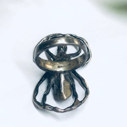 Vintage sterling silver spider ring with intricate detailing, a spooky statement jewelry piece perfect for insect or arachnid enthusiasts.