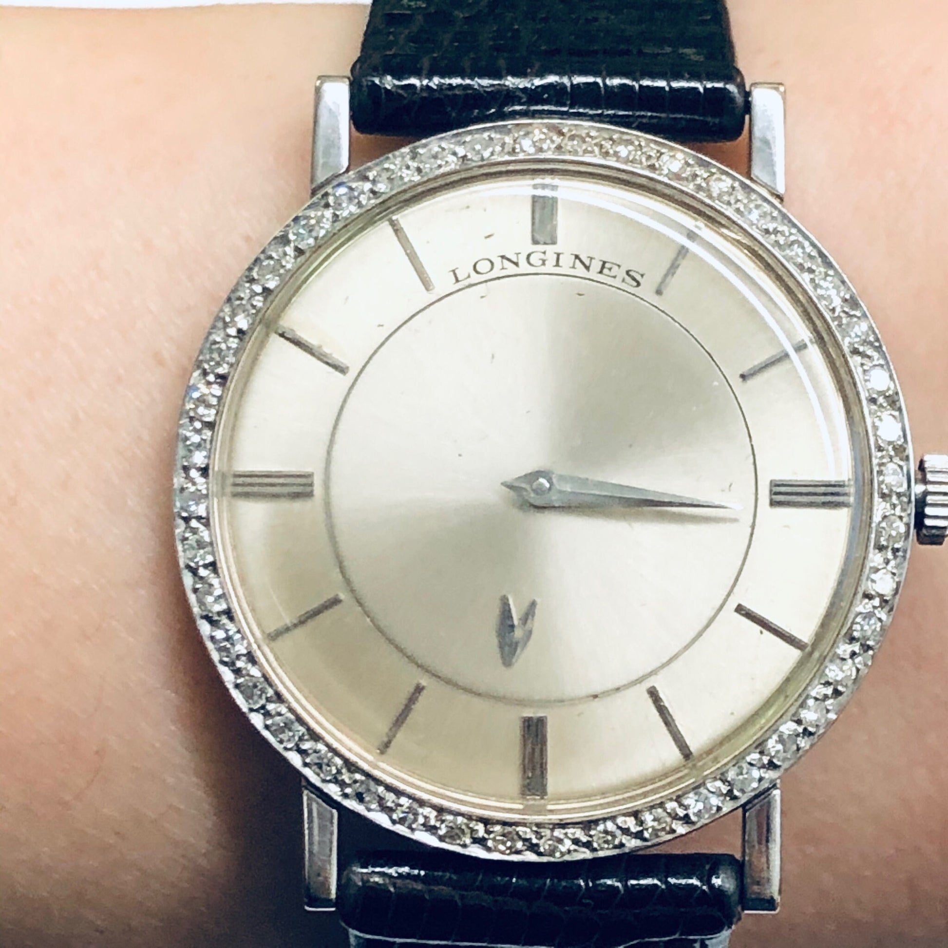 Vintage Longines mystery dial watch with 18K white gold case, diamond bezel, and leather strap - working unisex wristwatch