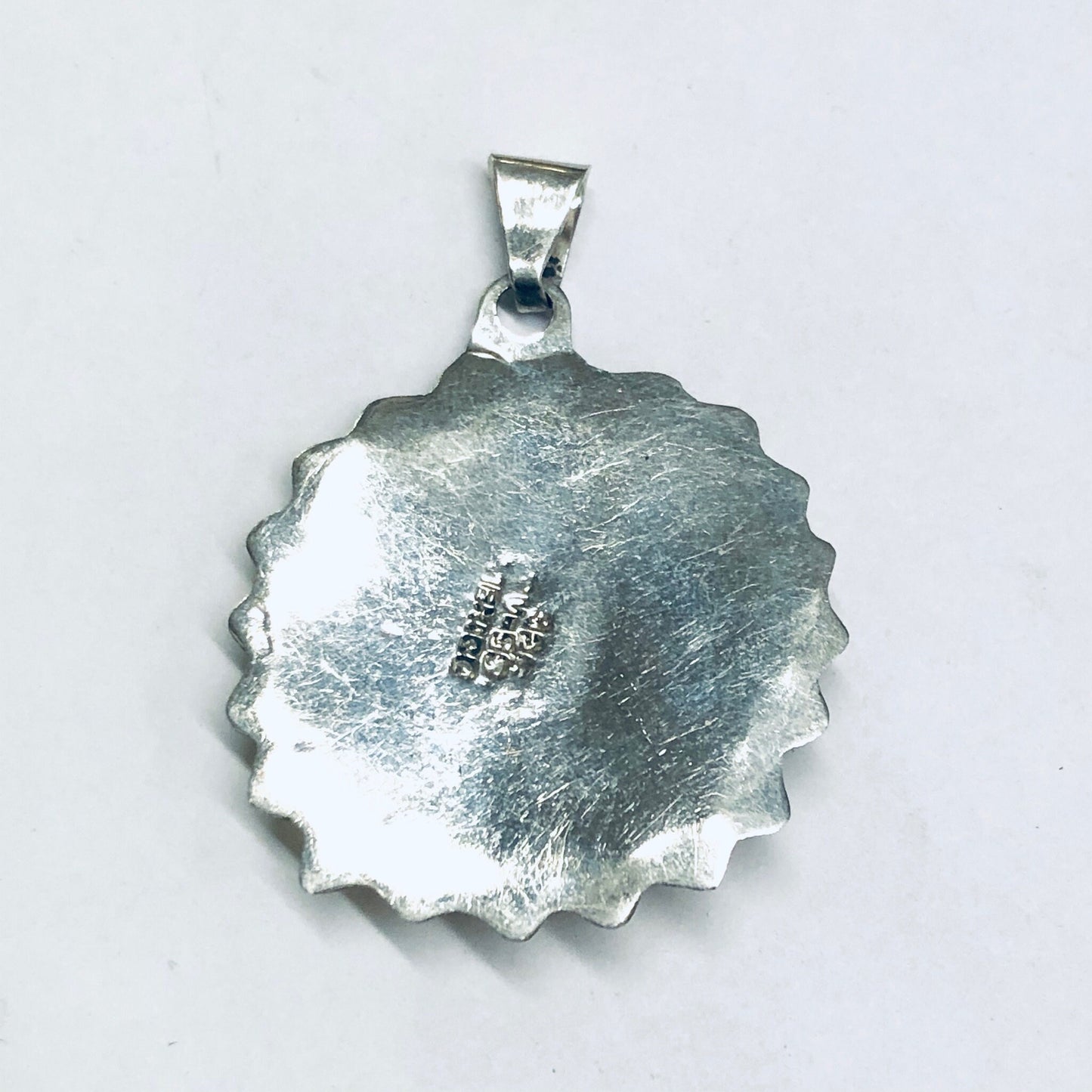 Vintage silver sun pendant charm with gold accent, round textured design resembling a sun face, for making vintage-style necklaces or jewelry.