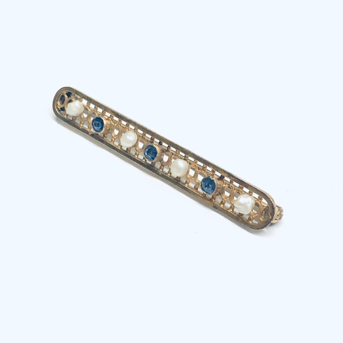 Vintage 14K gold bar pin brooch with lattice design, set with pearls and faceted blue gemstones. Measures 1 3/4 inches long.