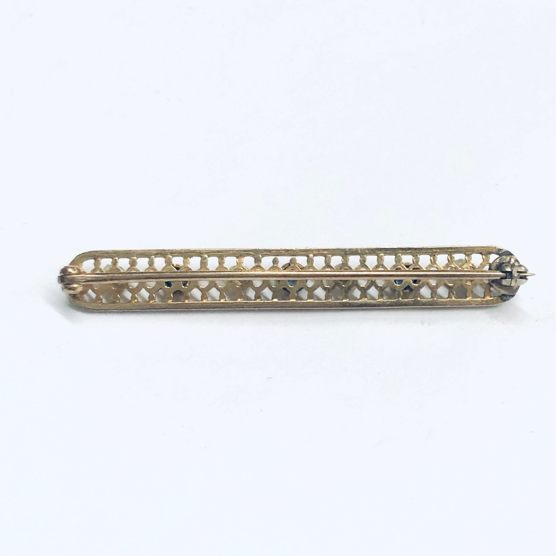 Vintage 14K yellow gold lattice design bar pin brooch with seed pearls and faceted blue gemstones, 1 3/4 inches long, cute jacket or lapel pin from antique or estate jewelry collection.