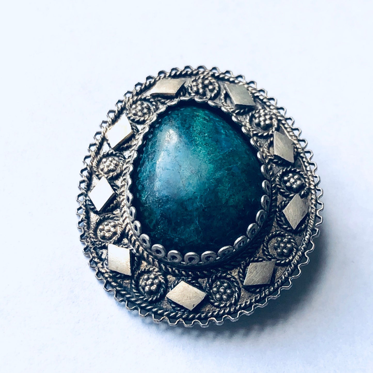 Vintage silver brooch pendant with green stone and intricate floral design, perfect as a unique Mother's Day gift or statement jewelry piece.