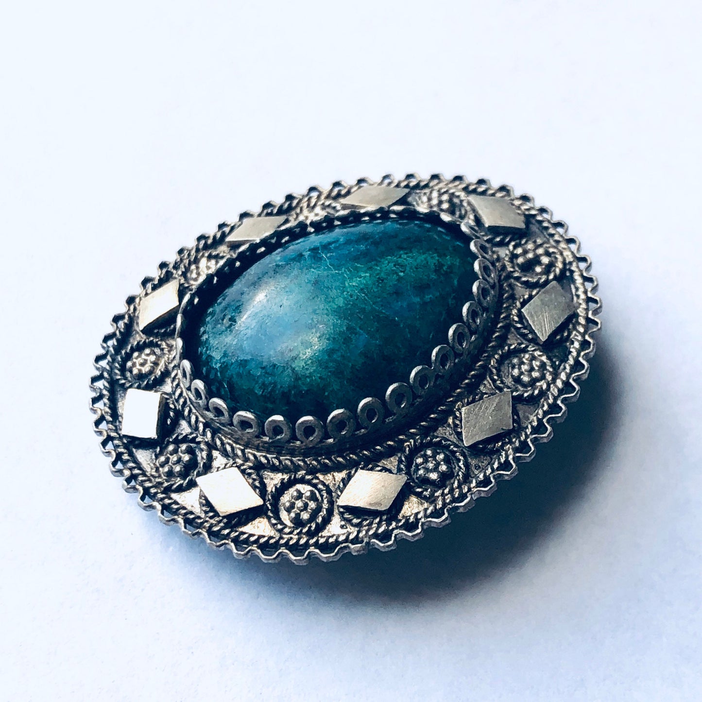 Vintage silver brooch pendant with green stone and intricate floral design, perfect as a unique Mother's Day gift or statement jewelry piece.