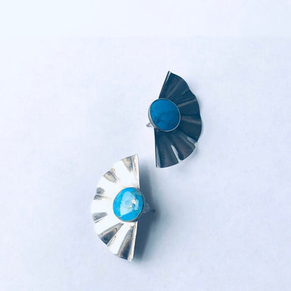 Vintage silver fan-shaped earrings with blue gemstones for pierced ears on white background