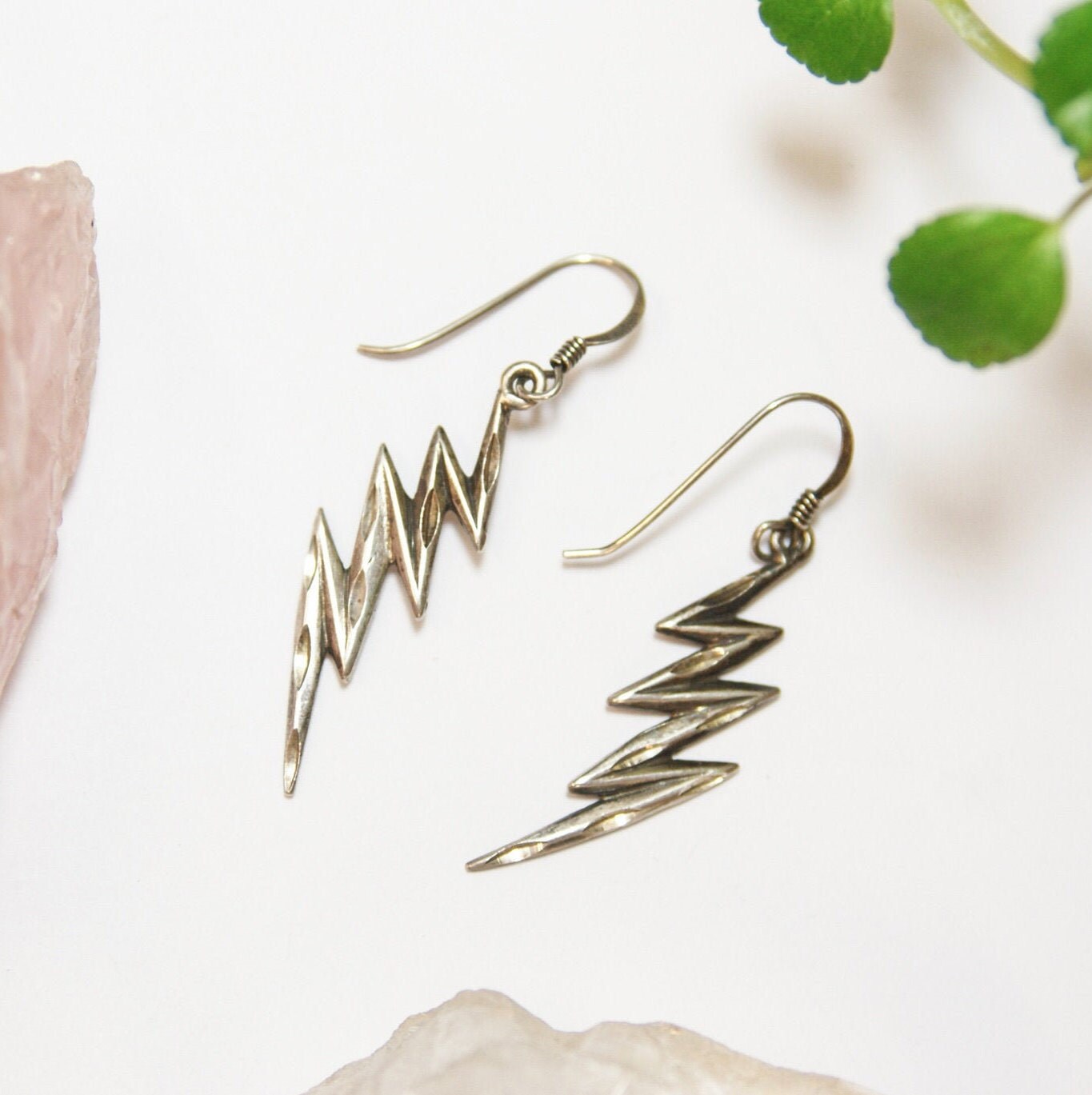 Vintage Sterling Silver Lightning Bolt Earrings on pink quartz with green leaves