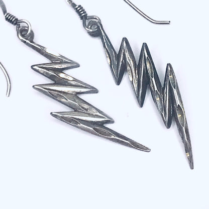 Vintage sterling silver lightning bolt earrings with carved details and minimal dangle design, unique silver dangle earrings