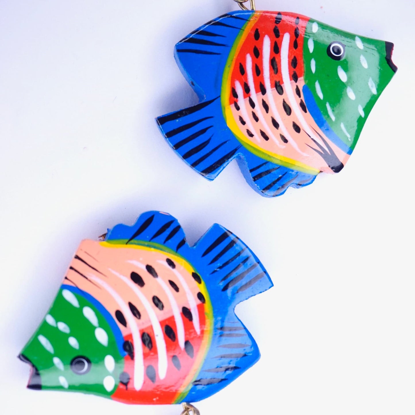 Colorful vintage wood carved fish earrings with vibrant painted details, cute handmade wooden dangle statement accessories.