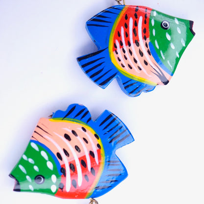 Colorful vintage wooden fish-shaped earrings with intricate carvings and painted detailing on a white background.