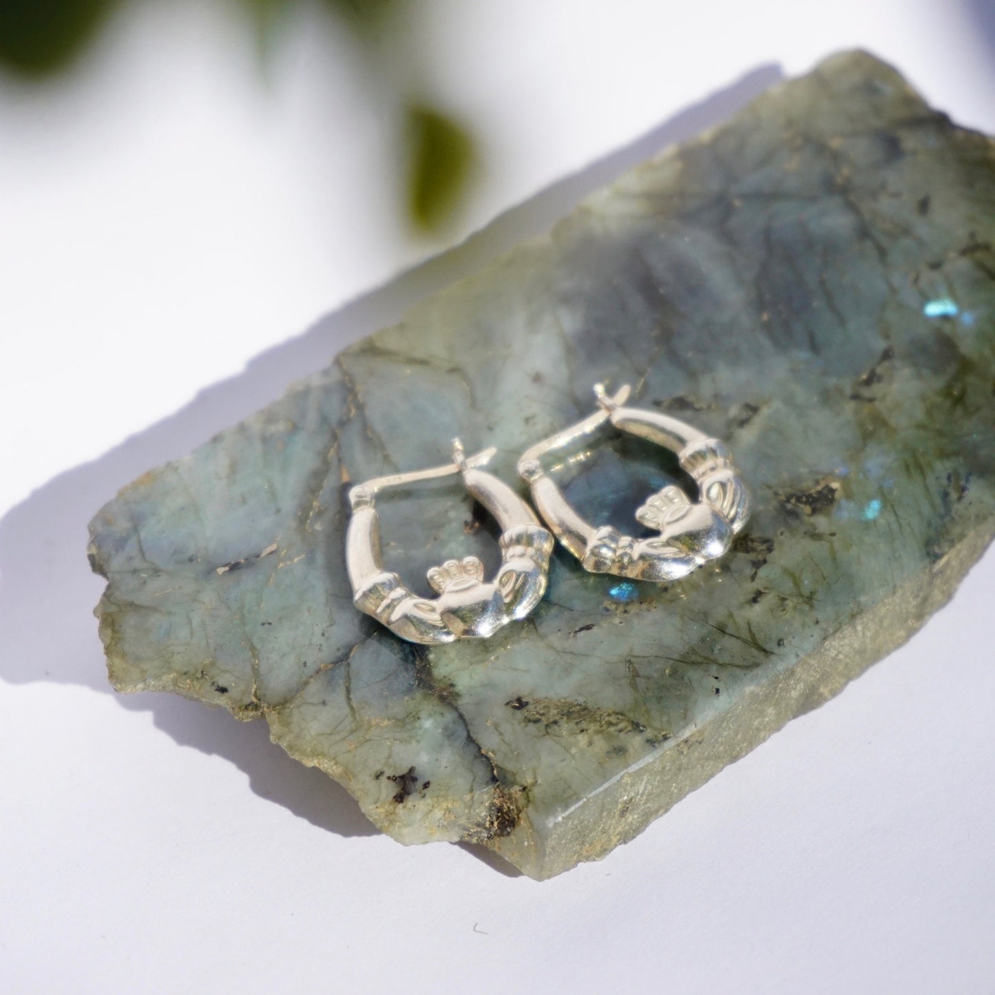 Vintage Sterling Silver Claddagh Hoop Earrings displayed on mineral slab, featuring Classic Irish Symbol for Love, Loyalty, and Friendship, 925 Stamped Jewelry.
