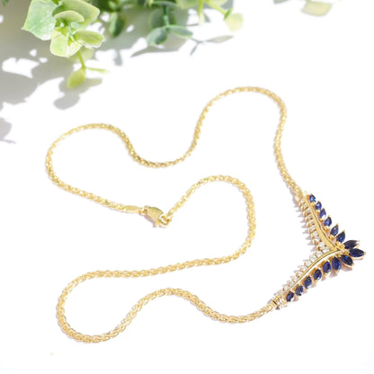 Vintage 14k gold choker necklace with sapphire and diamond accents, featuring an elegant design of linked gold chains adorned with deep blue sapphire stones and sparkling diamond details.