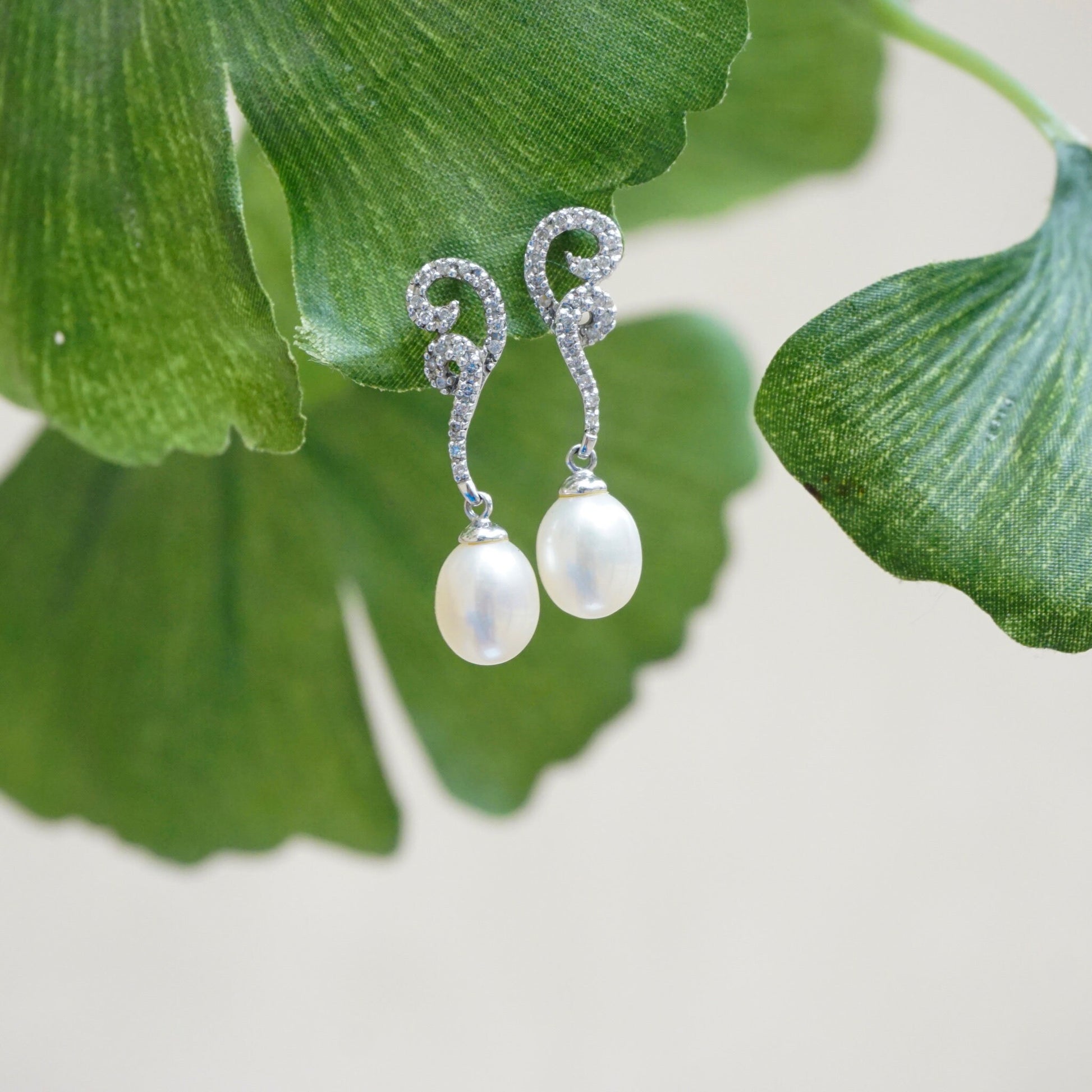 Vintage 14K white gold pearl drop earrings with diamond accents on green leaves, delicate pearl and diamond stud earrings, fine jewelry gift idea