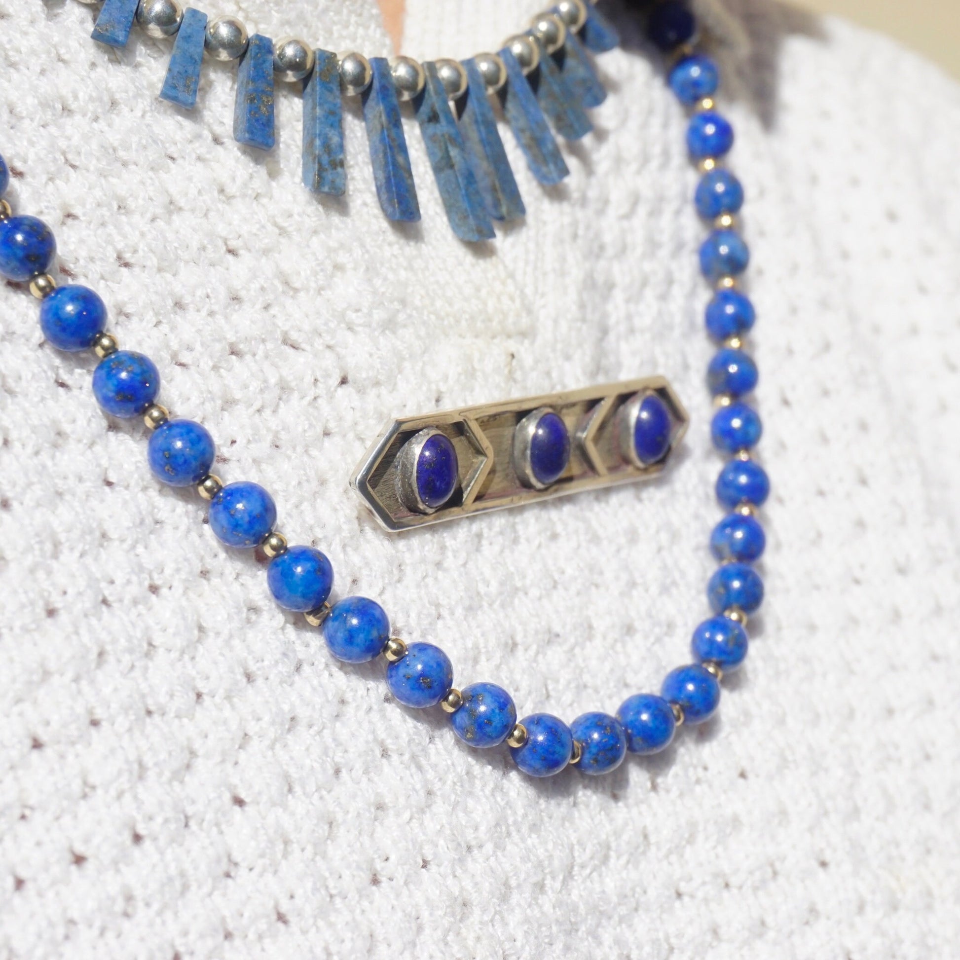 Vintage lapis lazuli and sterling silver minimalist brooch necklace featuring three genuine lapis lazuli gemstones and polished silver bar accents on a delicate beaded chain, handcrafted artisan jewelry design.