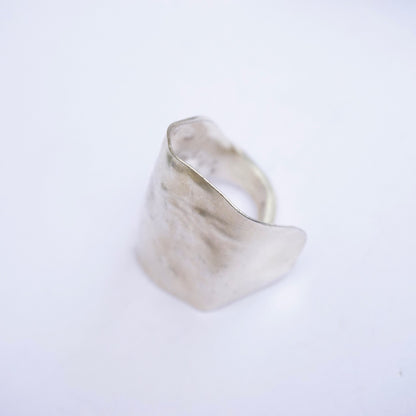 Vintage sterling silver spoon ring handcrafted into a unique statement piece, bent to size 8 US.